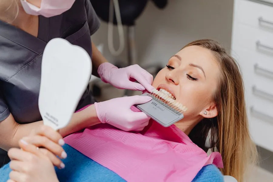 Patient checking her new smile shade at the Fort Myers dentist